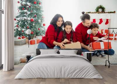 Portrait of four nice attractive lovely idyllic sweet adorable cheerful dreamy big full foster family celebrating spending newyear leisure eve noel festal day light white interior living-room Wall mural