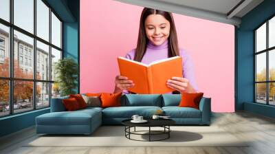 Portrait of her she nice attractive pretty lovely educated cheerful cheery focused long-haired girl reading dictionary paper book isolated over pink pastel color background Wall mural