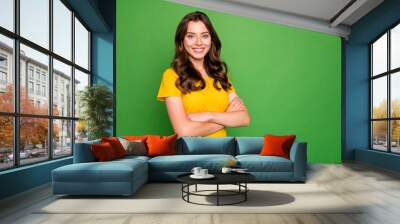 Portrait of her she nice-looking attractive lovely winsome cheerful cheery content wavy-haired girl folded arms isolated over bright vivid shine vibrant green color background Wall mural