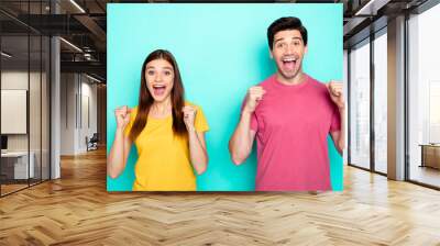 Portrait of his he her she nice attractive lovely glad cheerful cheery couple celebrating attainment good news isolated over bright vivid shine vibrant green blue turquoise background Wall mural