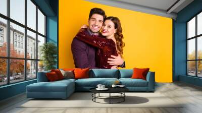 Portrait of his he her she nice-looking attractive lovely lovable smart charming sweet cheerful cheery people cuddling spending celebratory time isolated over bright vivid shine yellow background Wall mural