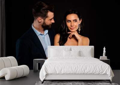 Portrait of his he her she nice-looking attractive lovely luxury adorable pretty shine fascinating dreamy two person guy giving handling cool expensive package isolated over black background Wall mural