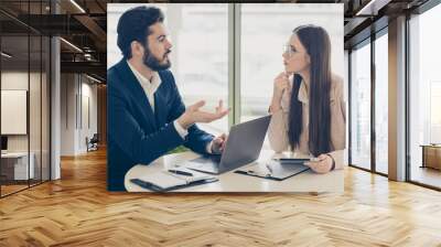 Portrait of his he her she two nice attractive experienced skilled employees coworkers discussing company growth plan marketing strategy income investment at light white workplace workstation Wall mural