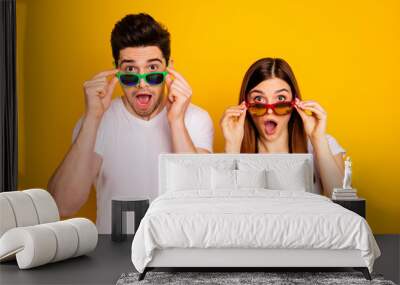 Portrait of his he her she two nice attractive lovely charming stylish trendy stunned people opened mouth isolated over vivid shine bright yellow background Wall mural