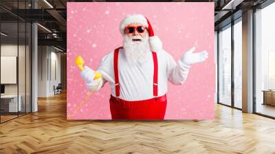 Portrait of his he nice attractive cheerful cheery glad Santa father talking on yellow phone contact center communication ho-ho holly jolly isolated over pink pastel color background Wall mural