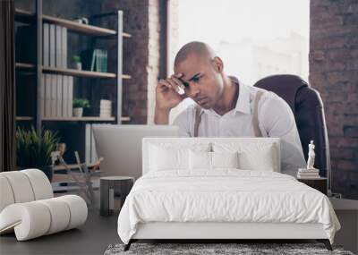 Portrait of his he nice attractive stylish trendy worried sad guy freelancer company founder reading financial report fail failure at industrial loft interior work place station indoors Wall mural