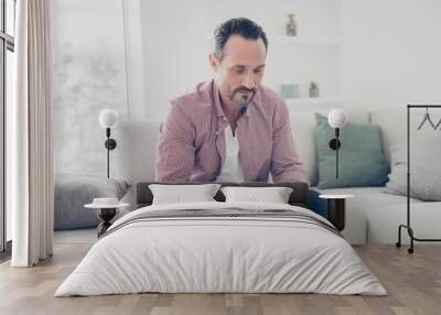 Portrait of man sit wear in casual denim clothes jeans and check Wall mural