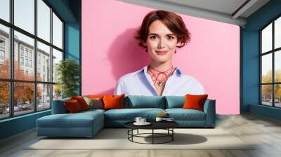 Portrait of positive cheerful adorable nice girl with bob hairstyle wear blue stylish blouse smiling isolated on pink color background Wall mural