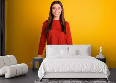 Portrait of positive cheerful girl have fun enjoy her free time with friends look stare feel content candid emotions wear red pullover sweater isolated over yellow color background Wall mural