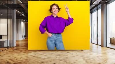 Portrait of young business lady wear trendy outfit show v-sign greetings her coworkers in office isolated over yellow color background Wall mural