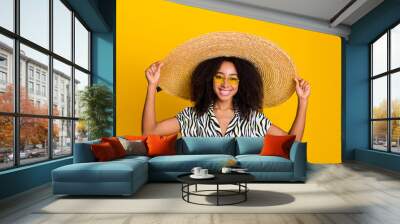 Portrait photo of glamour young charming woman curly hair in sunhat wear zebra print shirt isolated on yellow color background Wall mural