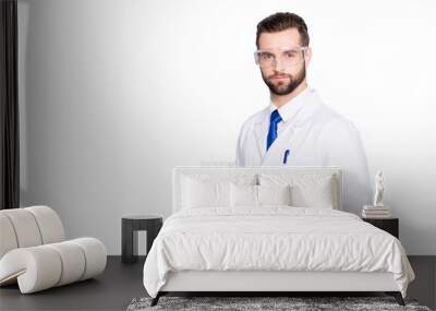 Portrait with copy space, empty place of attractive stylish  scientist with bristle in white lab coat, tie holding test tubes with multi-colored liquid, looking at camera over grey background Wall mural