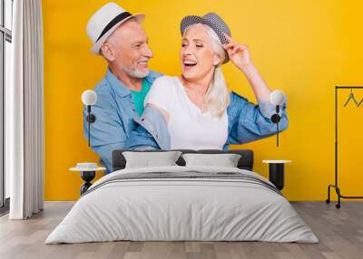 Positive weekend vacation holiday travel trip denim white clothes concept. Close up photo portrait of funny funky handsome attractive old guy lady joking chatting talking isolated on bright background Wall mural