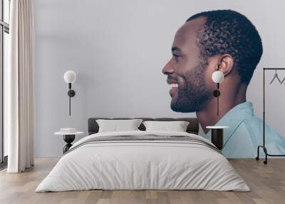 Profile, side view portrait with copy space, empty place for product of virile, smiling, manly, positive, cheerful man isolated on grey background Wall mural