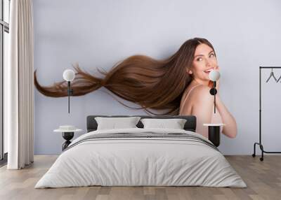 Profile photo of attractive cute model lady demonstrating ideal neat long healthy hairstyle flying on air after lamination procedure wear beige singlet isolated grey color background Wall mural