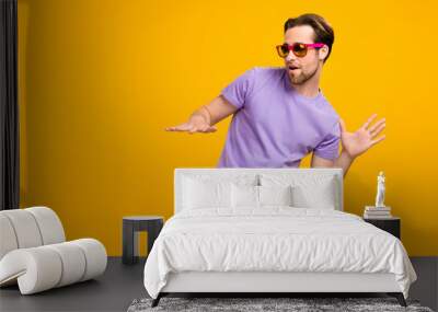 Profile photo of funny cool dj guy play popular track wear sunglass purple t-shirt isolated yellow color background Wall mural