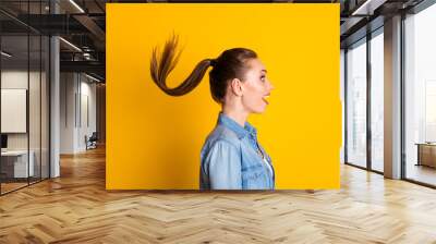 Profile side photo of astonished positive girl look good mood wonderful novelty her haircut air wind fly wear style stylish trendy outfit isolated over bright shine color background Wall mural