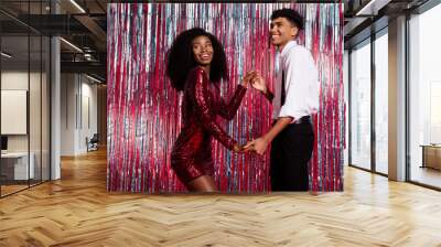 Profile side photo of young black couple happy smile dance new year party suspenders red sequins dress isolated over glitter color background Wall mural