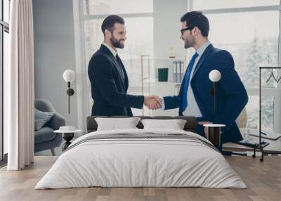 Profile side view of two nice attractive ambitious trendy imposing cheerful cheery men expert employer hr ceo boss chief shaking hands hiring talent at light white interior workplace workstation Wall mural