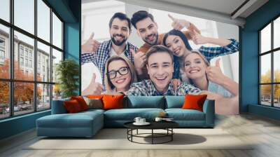 Self portrait of economists, students, financiers, lawyers in casual outfit showing thumb up with fingers shooting selfie on front camera with joyful cheerful expression having leisure, timeout Wall mural