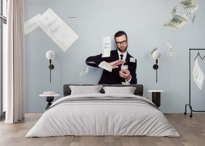 Spectacles jackpot entrepreneur economist banker chic posh manager jacket concept. Handsome confident cunning clever wealthy rich luxury guy holding wasting stack of money isolated on gray background Wall mural