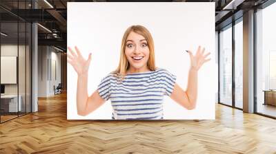 Surprised happy girl gesturing with hands Wall mural