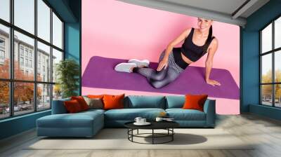 Top above high angle full body photo of young sportive girl happy smile sit mat rest training isolated over pink color background Wall mural