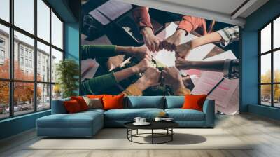 Top above high angle view cropped photo marketers partners put fists together round circle support start-up goals teambuilding training concept above table desk workstation workplace Wall mural