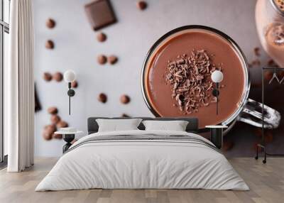 chocolate smoothie in a glass topped with chocolate chips healthy breakfast drink idea Wall mural