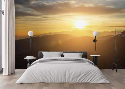 Glowing sunset view over the desert mountain landscape of Joshua Tree National Park in California Wall mural