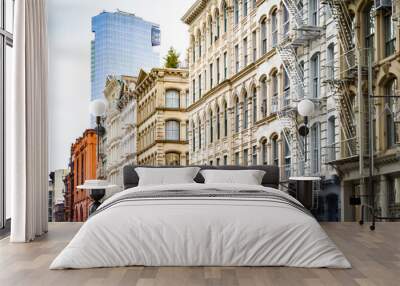 New modern building rises above the old historic buildings of SoHo in Manhattan, New York City Wall mural