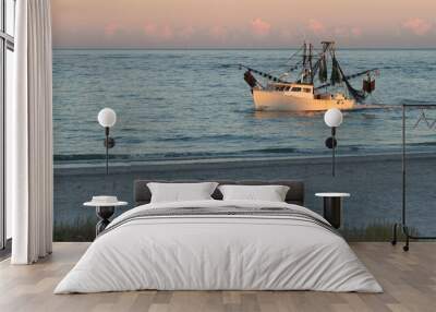 Shrimp boat along the North Carolina shoreline in the light of the setting sun. Wall mural