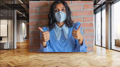 Young indian woman wearing a mask
 Wall mural