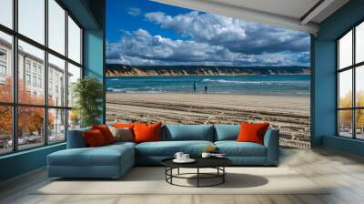 Fishing at Double Island Point, Rainbow Beach, Queensland, Australia. Man and boy fishing with Rainbow coloured sands in the background. Wall mural