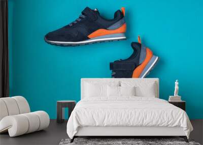 Pair of new sneakers, sport shoes on blue background. Sport, running shoes Wall mural