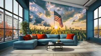 An inspiring image of the american flag waving proudly at sunset in a serene open field Wall mural