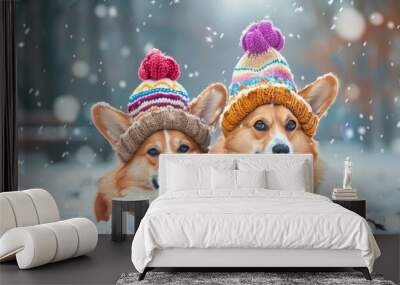 Charming winter scene of two adorable corgis in colorful hats amidst falling snowflakes Wall mural