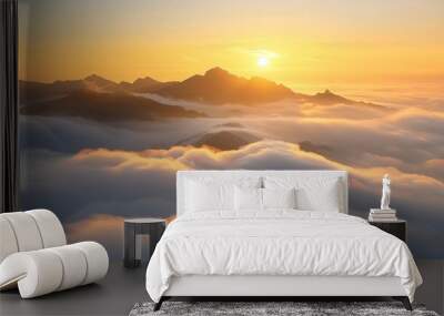 Majestic sunrise over cloud covered mountains in hd photography capturing spectacular scenery Wall mural