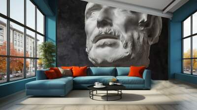 Gypsum copy of ancient statue Seneca head on dark textured background. Plaster sculpture man face. Wall mural