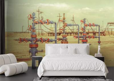 Wellheads with valve armature on a oil field. Wall mural