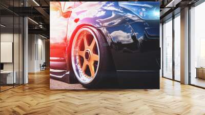 Close up of headlight and car wheel with custom disk of tuned low rider sport car Wall mural