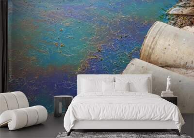 Sewer pipes at shore, stain of oil or fuel on water surface, nature pollution by toxic chemicals, dirty sea concept Wall mural