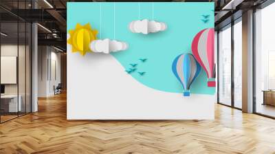 Cute papercut sky landscape background with white copy space. Hot air balloon, sun and clouds made in realistic paper craft art or origami style for baby nursery, children design. Wall mural