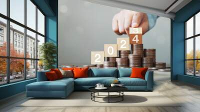 New year 2024 start concept, preparation for planning of business to grow. New life, new business, plans, goals, strategy concept. Hand flips wooden cube with years 2023 to 2024 Wall mural