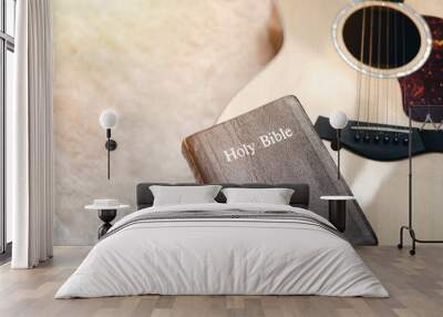 Christians worship God with a guitar with the Holy Bible. reading the Bible and sharing the gospel with copy space for the word of god. Wall mural