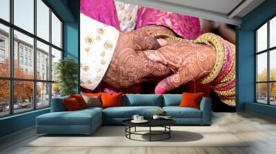 Closup of Indian Young adult male groom and female bride holding hands Wall mural