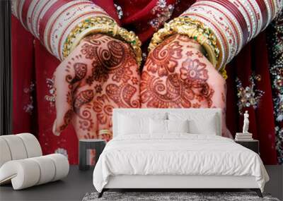 Indian bride showing Mehndi design and gold bracelet and colorful bangle Wall mural