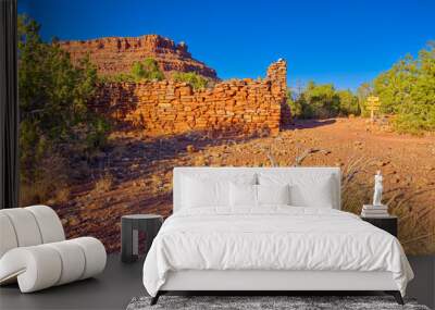 The ruins of a Mining Camp on Horseshoe Mesa at the Grand Canyon. The ridge in the background is the center of Horseshoe Mesa. A sign on the right marks 2 separate trails.  Wall mural