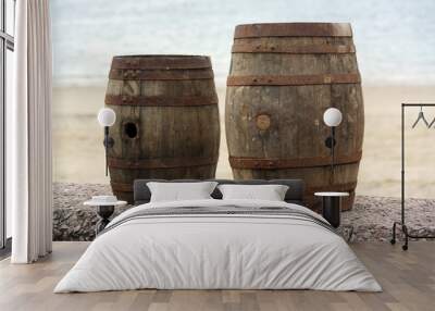 Two old wooden barrels for distilled beverage at a flea market Wall mural