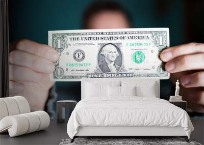 A man holds a U.S. 1 one dollar Wall mural